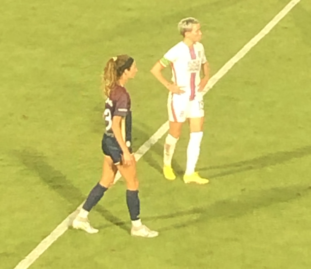 Megan Rapinoe of OL Reign (right) vs. the North Carolina Courage