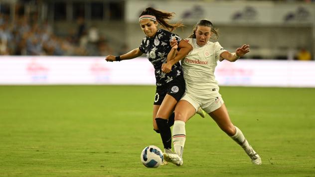 Racing Louisville FC forward Nadia Nadim (left) vs. the Portland Thorns