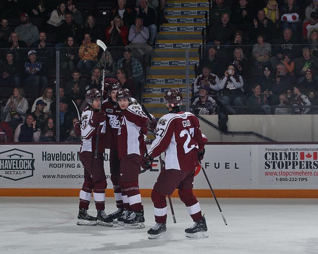 Peterborough Petes' James Guo celebrates win with teammates