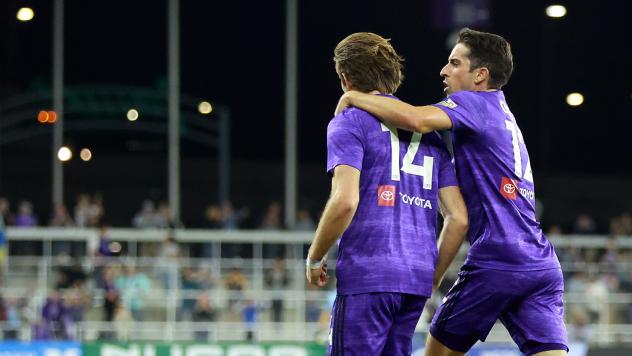 Louisville City FC's Wilson Harris and Tyler Gibson celebrate win