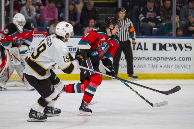 Kelowna Rockets defenceman Caden Price (right) vs. the Brandon Wheat Kings