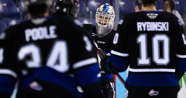 Victoria Royals' Jake Poole, Luke Rybinski and goaltender Tyler Palmer celebrate win