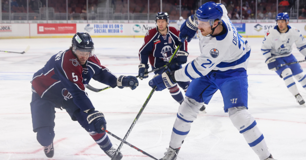 Wichita Thunder forward Jay Dickman (right) vs. the Tulsa Oilers