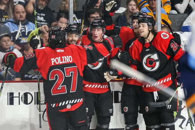 Cincinnati Cyclones' Patrick Polino and Luc Brown celebrate win with team