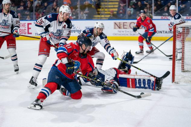 Springfield Thunderbirds left wing Hugh McGing reaches for a puck against the Hartford Wolf Pack